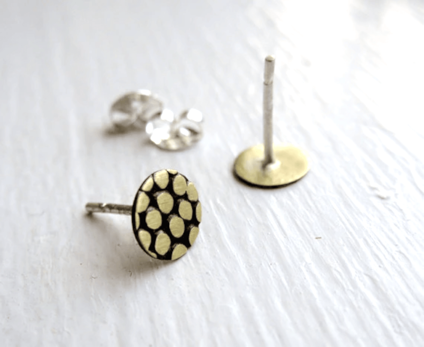 A close-up shot of the sterling silver posts and butterfly backs, emphasizing quality and craftsmanship.