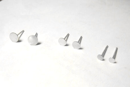 Matte circle stud earrings in all sizes displayed together