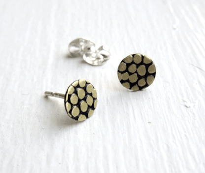 Pair of earrings displayed on a neutral background, highlighting the matte and polished finish options.